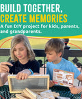 Two kids assembling Picnic Table Bird Feeder Kit For DIY Family Fun With Tools And Paint Set FSC Certified New Zealand Pine.
