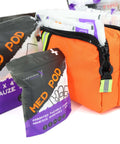 Orange Lightning X EMS trauma bag with black zipper; stocked with gauze packs.