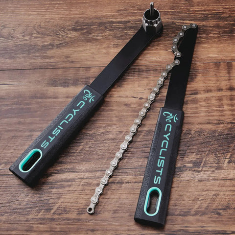 Must Have Cassette Removal Tool Set With Chain Whip And Lock Ring Tool For HG Cassettes And Freewheels on wooden surface