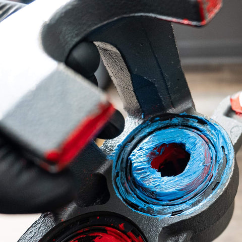 Ceramic Brake Lubricant For Extreme Heat High Temp Performance That Prevents Seizing And Squeaks applied on caliper piston.