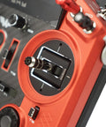 Close-up of Tandem X20 PRO AW Radio Transmitter Ultimate Bundle control stick on vibrant orange CNC shell