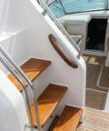 Premium Teak Handrail With Pre Drilled No Sweat Mounting For Tight Spaces Versatile Wall Grip providing solid safety support for boat stairs.