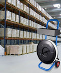 Heavy Duty Strapping Cart Rolling Dispenser Stand For 8 Inch Poly And Steel Coils Smart Mobile Workstation in warehouse setting.