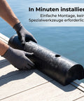 Person installing Beefy Rubber Dock Bumper And Semi Circular Dock Guard, marine-grade, black, on pier for protection.