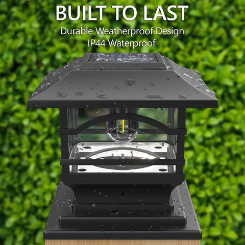 Need These Tight Solar Post Cap Lights For Fences Decks And Patios Featuring Killer Edison Style Bulbs That Auto Trigger At Dusk In Fresh Slate Black Trim with water droplets.