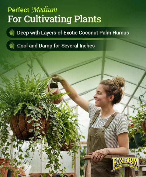 Gardener tending hanging plants with Coco Loco Potting Mix With Bat Guano And Earthworm Castings For Great Drainage And Water Retention