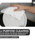 Person cleaning with 60 Pack White Cotton Terry Bar Mop Towels, 14X17 Inches, Super Absorbent Cleaning Rags, reusable towels