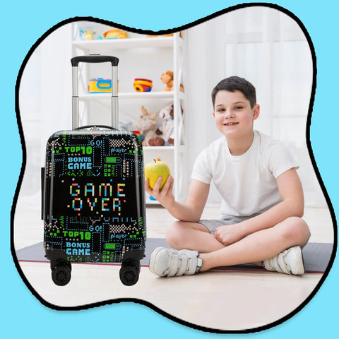 Kids 16 Inch Travel Suitcase Set With Smooth Rolling Spinner Wheels For Boys Carry On Hard Shell Luggage Airline Approved 2 In 1 Gift Pack Includes Neck Pillow Case And Luggage Tag By Homskiii Great Gift For Kids, featuring a boy, black suitcase with game theme pattern, and modern room setting.