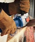 Street Tough 4.5 Inch Angle Grinder Featuring X Lock Tool Free Disc Swap Mount used for cutting metal with sparks flying.