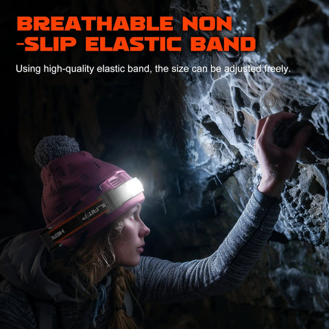 Person wearing Two Pack Rechargeable Headlamp With 1000 Lumens And 230 Degree Wide Beam Red Taillight Three Modes Lightweight Waterproof LED Head Light For Running Cycling Camping And Nighttime Outdoor Adventures while exploring a cave