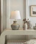 Grey Organic Gourd Ceramic Table Lamp for Bedroom, Living Room, Dining, Entryway - 18 Inch Tall With Rotary Switch displayed on a console.