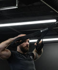 Man using Ultimate Tricep Rope Attachment with Built In Three Lengths, Multi Grip Cable for triceps workout in gym setting