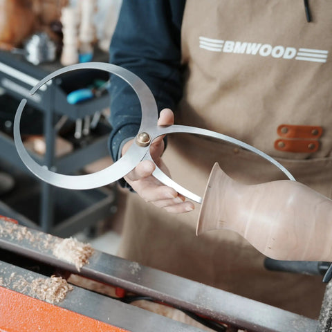 Hella Durable Double Ended Bowl Calipers Stainless Steel Woodworking Measuring Tool for Inner Outer Diameter and Wall Thickness Gauge, held against a turned vessel.