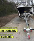 Heavy Duty Trailer Tug Man Moves Rv And Boat Trailers Up To 20K Lbs Capacity With 3500 Lb Tongue Weight Max, shown with boat on trailer.