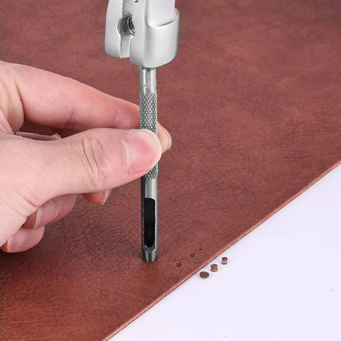 Using Leather Hole Punch Set With Hollow Punch Tools on brown leather for crafting precise holes, showing knurled grip and punch in action.