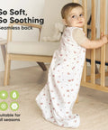 Baby in Two Pack Organic Cotton Baby Sleep Sacks 0.5 TOG for 6 to 18 Months Butterflies Pattern, standing by crib