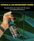 Hand holding Marine Gear Lubricant And Cleaner For Reels, Boat Motors, Downriggers And Tackle, 16 Oz Trigger Spray Saltwater Safe.