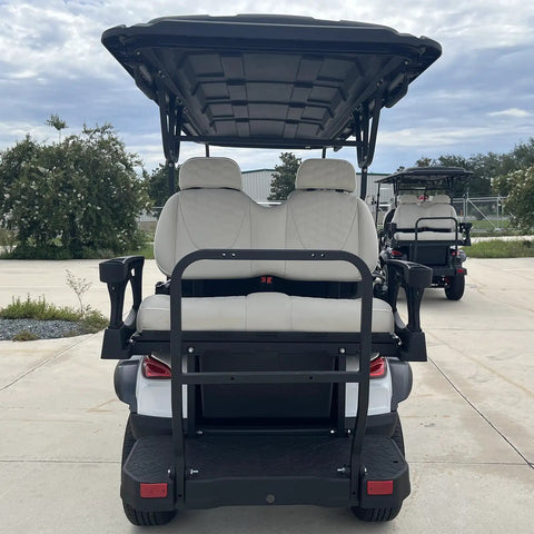 High Capacity Six Passenger Electric Golf Cart Featuring Rear Flip Seats Quiet Motor Drive Plush Padded Upholstery And Built In Armrests rear view with plush seats.
