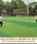 Portable 12ft Volleyball Training Net for hitting and serving drills, freestanding indoor outdoor practice net with players on a field.