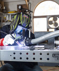 Person using Weld Pak 225i Dual Voltage Stick and TIG Welder 120V 230V, 10 to 225 Amp Output in home garage setting