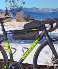 Bicycle with Long John Frame Bag For Bikes With Dual Duty Top Tube And Frame Storage, Side Zippers, Multi-Position Straps in snowy landscape