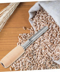 Stainless Steel Grain Sampler With Wooden Handle For Wheat And Rice Sampling, showing tool on grains