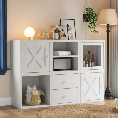 White washed stackable cube storage organizer with shelves, drawers, and decor items in a home setting.