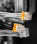 Ideal Electrical in-Sure 3-port push-in wire connectors, orange translucent housing; two shown