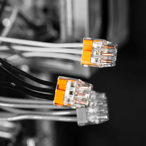 Ideal Electrical in-Sure 3-port push-in wire connectors, orange translucent housing; two shown