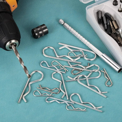 Heavy Duty 1 Mm By 17 Mm Cotter Pins Spring Fasteners Hairpin Retaining Pins R Clip Kit For Bolts And Pins In Metalwork And Equipment Applications 20 Pcs Galvanized Carbon Steel Silver Tone Uxcell scattered on a workbench with a drill and tools.
