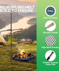 Swivel Campfire Grill Heavy Duty Fire Pit Grate 360 Degree Adjustable Steel Cooking Rack next to a campfire in the outdoors.
