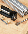 Dead Nuts Accurate Aluminum Profile Tapping Aid Tool With Heavy Duty Tap Guide Jig on wooden surface with hardware and drill.