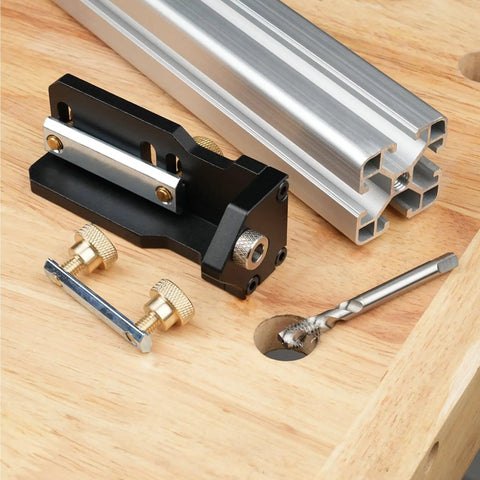 Dead Nuts Accurate Aluminum Profile Tapping Aid Tool With Heavy Duty Tap Guide Jig on wooden surface with hardware and drill.