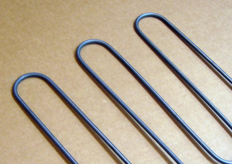 Close-up of Genuine OEM Broil Element 316203301 for Electric Ranges, showing black metal loops for high heat oven broiler replacement.
