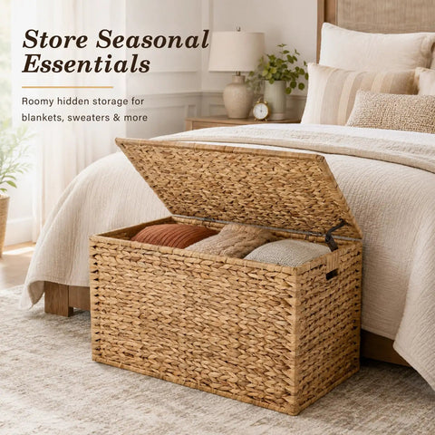 Handwoven Water Hyacinth Storage Trunk With Lid And Handles by a bed, used for storing blankets, natural finish, boho farmhouse decor