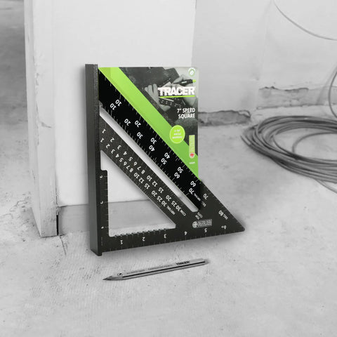 7 Inch Aluminum Rafter Square With Imperial Hip Valley Scales For Dead Easy Roofing Layouts, positioned against a wall.