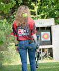 Archer walking with a bow, Pocket Quiver holds six arrows clip in back pocket or on belt, target in the background