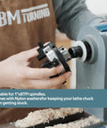 Straight Shooter 3 Inch Wood Lathe Chuck featuring 4 reversible jaws being attached to a lathe for woodturning.