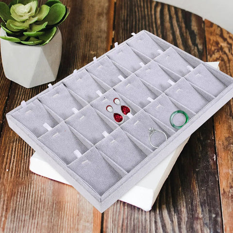Large Grey Velvet Jewelry Tray With 18 Grid Dividers For Necklace And Watch Storage Soft Lined Organizer Dish on wooden surface with jewelry in compartments.