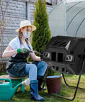 Woman using 42 Gallon Outdoor Dual Chamber Compost Tumbler With Sliding Doors No Sweat Heavy Duty Rotating Batch Composter For Garden