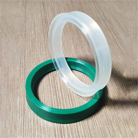 Premium Polyurethane Hydraulic Cylinder Oil Sealing Ring Set For Piston Rod Shafts With Y And U Shape Configurations Designed To Stop Leaks And Ensure Peak Performance For Heavy Machinery Operators Needing Rock Solid Reliability Today. White and green polyurethane sealing rings on wood surface
