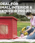 User applying paint with an 18V Cordless Paint And Stain Sprayer Delivering Slick HVLP Coatings on a red outdoor project.