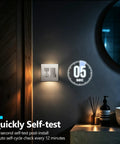 Brushed Nickel GFCI Outlet With Integrated LED Night Light Tamper Proof Receptacle, self-testing feature visible on wall.