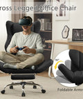 Person sitting on ergonomic cross legged office chair with footrest for big and tall folks, leather executive chair with reversible armrests.