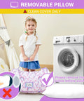 Toddler Nap Mat With Pillow And Blanket For Daycare And Preschool, child holding rolled mat near washing machine.
