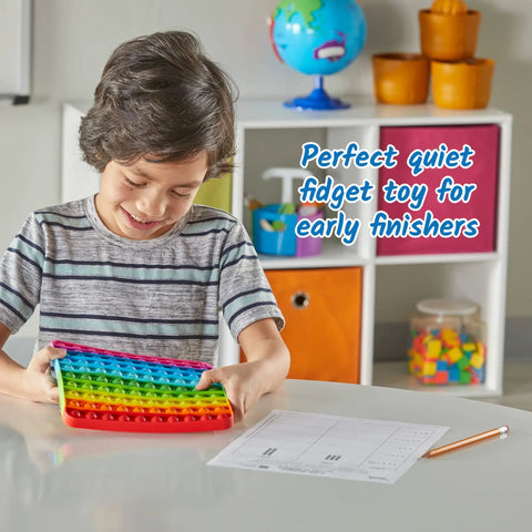 Child playing with a rainbow Hundred Board Pop Fidget Toy For Kiddos, Sensory Bubble Popper For Counting And Multiplication in classroom