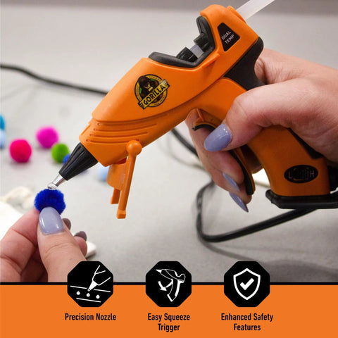 Dual Temp Mini Hot Glue Gun With Precision Nozzle, Easy Squeeze Trigger in use with small craft pom-poms