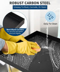 Person cleaning Heavy Duty Carbon Steel Washing Machine Drip Tray With Four Anti Vibration Feet 24 By 24 Inch No Hole Floor Protector for Front Load Washers and Spin Dryers Keeps Floors Safe And Mess Free with rubber gloves.