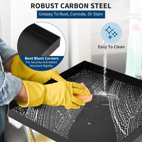 Person cleaning Heavy Duty Carbon Steel Washing Machine Drip Tray With Four Anti Vibration Feet 24 By 24 Inch No Hole Floor Protector for Front Load Washers and Spin Dryers Keeps Floors Safe And Mess Free with rubber gloves.