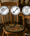 Round Chair Pad Featuring House And Sunflowers Folk Art Design, 14.5 inch, fade resistant, machine washable, on a wooden chair.